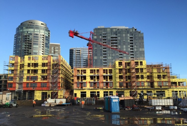 A construction site with a crane and a building under construction