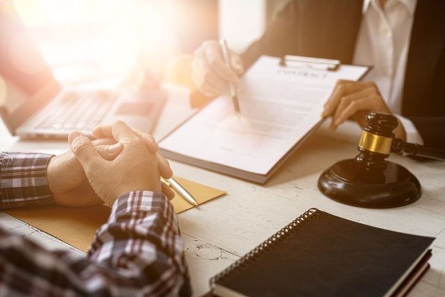 client lawyer reviewing contracts