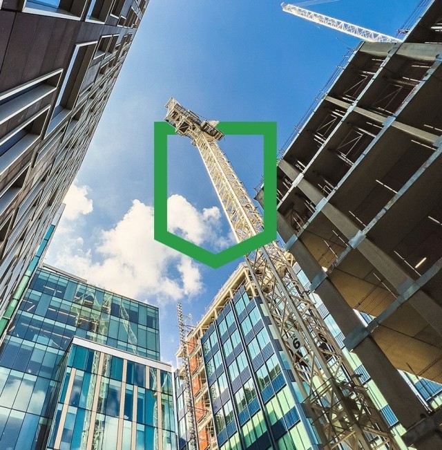 Building with crane and sunlight shining from the top