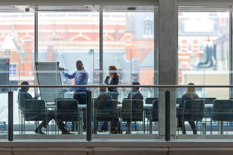 Directors and Officers meet during board discussion