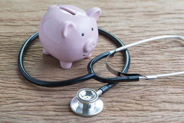 piggy bank with stethoscope