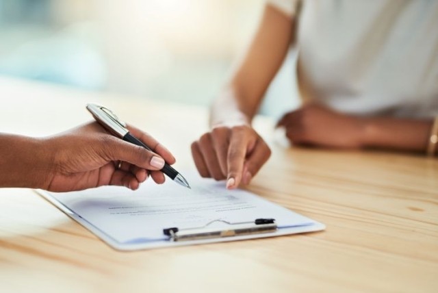 businesspeople going through paperwork in an office