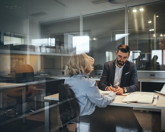 Two people working in modern office