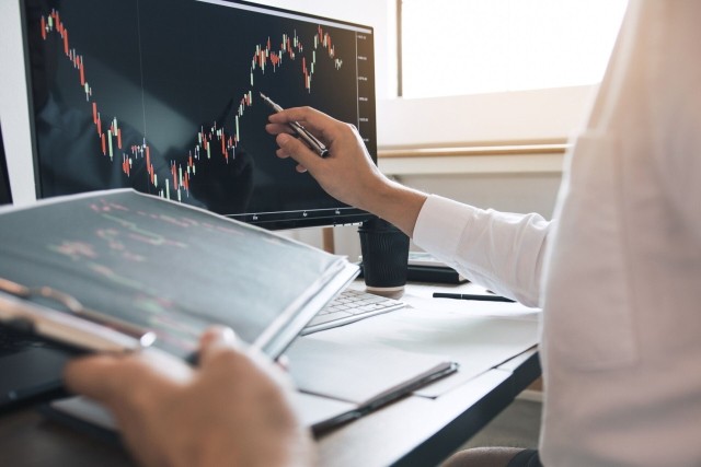 man analyzing the graph of the stock market