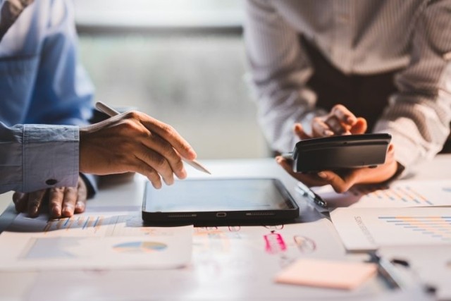 Business people using calculators