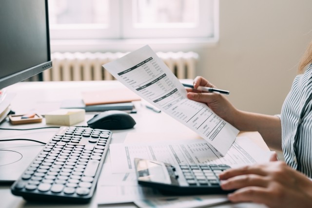 paperwork and using a calculator