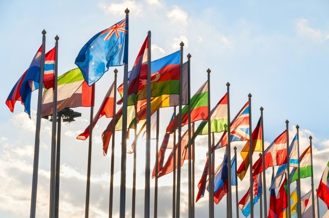image of flags from many countries being flown