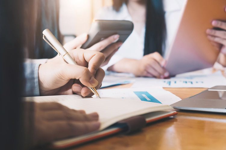 Team of attorneys discussing legal fees.