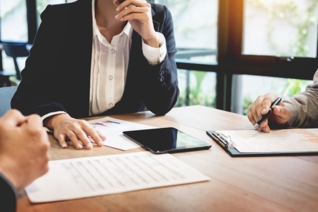 Tabletop meeting with paperwork