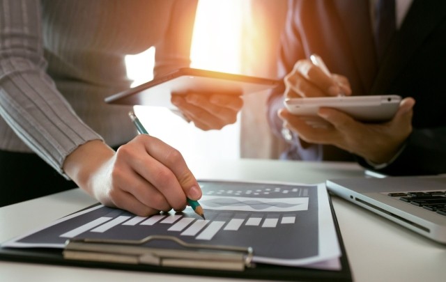 Team meeting with charts