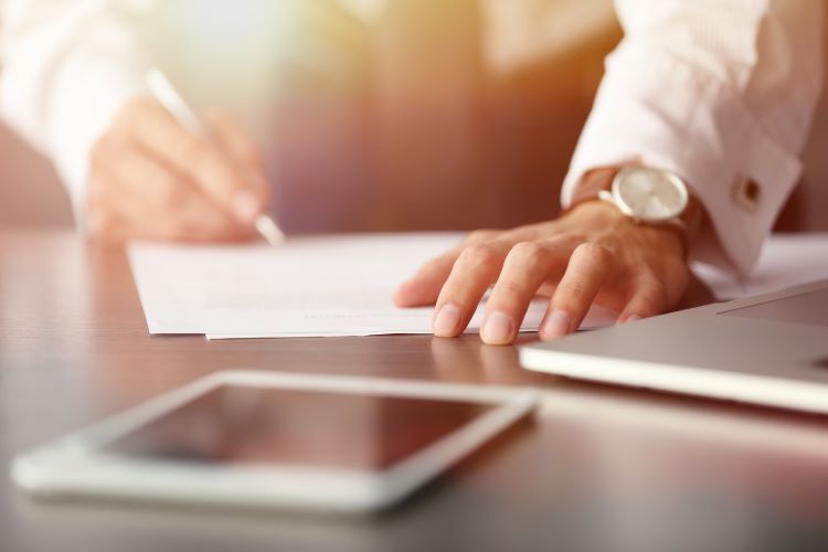 Man signing document