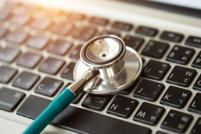stethoscope on laptop keyboard