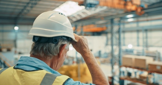 Aging workforce, older man tired at job