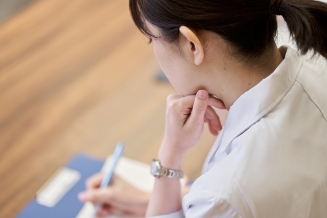 Woman looking over healthcare paperwork