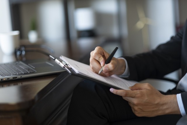 businessman prepares official document