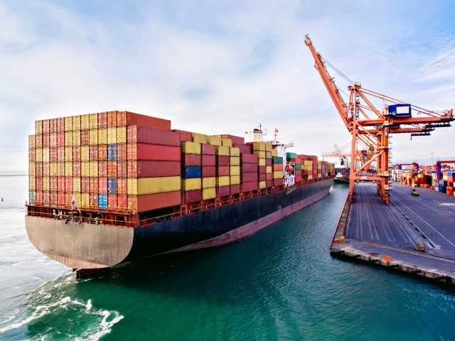 Aerial view of container ship approaching to an international port