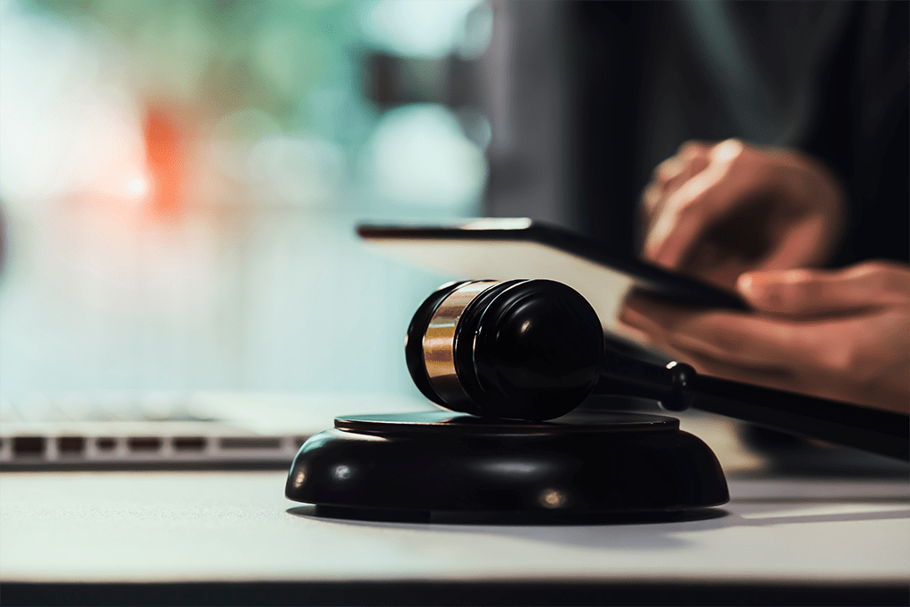 gavel, tablet, and computer on a judge's desk